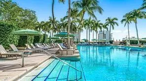 a view of swimming pool with chairs