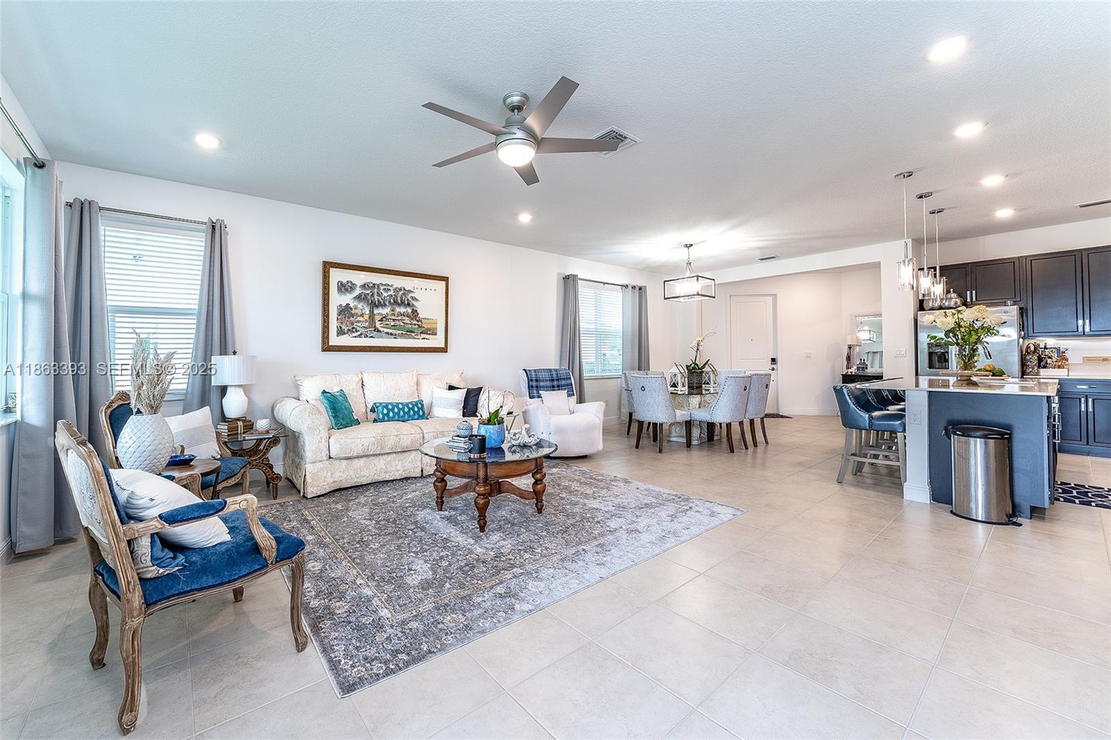 4230 Rosa Drive Deerfield Beach, FL 33064 - Photo 16 of 52 a living room with furniture and kitchen view