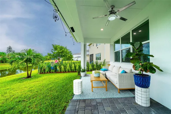 a front view of a house with garden and patio