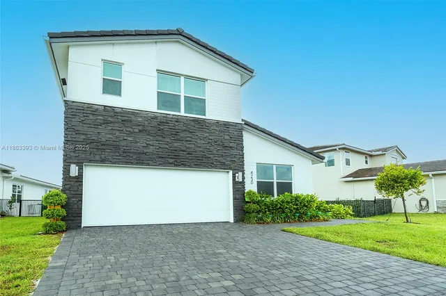 a house view with a garden space