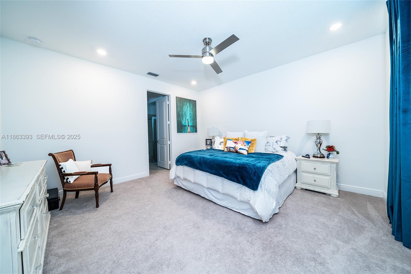 4230 Rosa Drive Deerfield Beach, FL 33064 - Photo 23 of 52 a bedroom with a bed and a chandelier