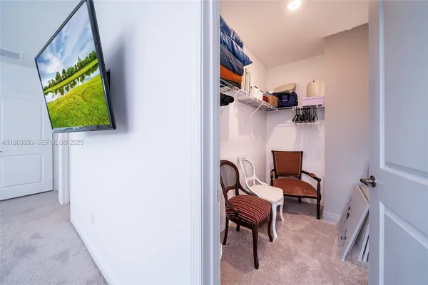 a spacious bathroom with a double vanity sink a mirror and a shower