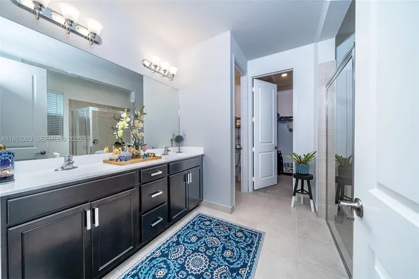 a bathroom with a shower and a sink