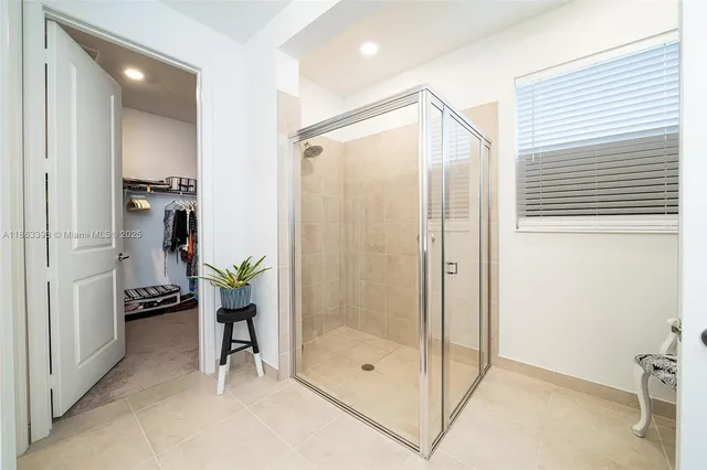 a bathroom with a shower and a sink