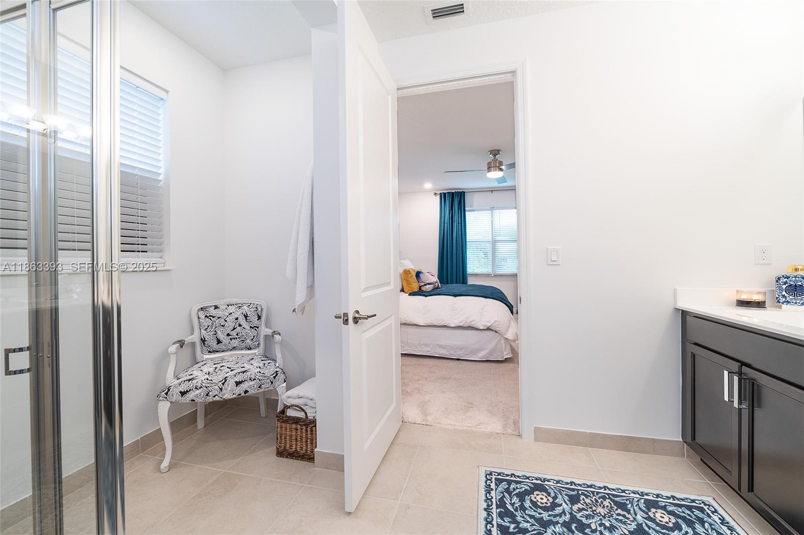 4230 Rosa Drive Deerfield Beach, FL 33064 - Photo 29 of 52 a bedroom with a bed and a window