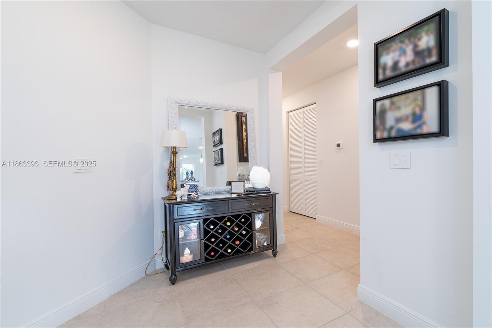 4230 Rosa Drive Deerfield Beach, FL 33064 - Photo 30 of 52 a living room with furniture and a mirror