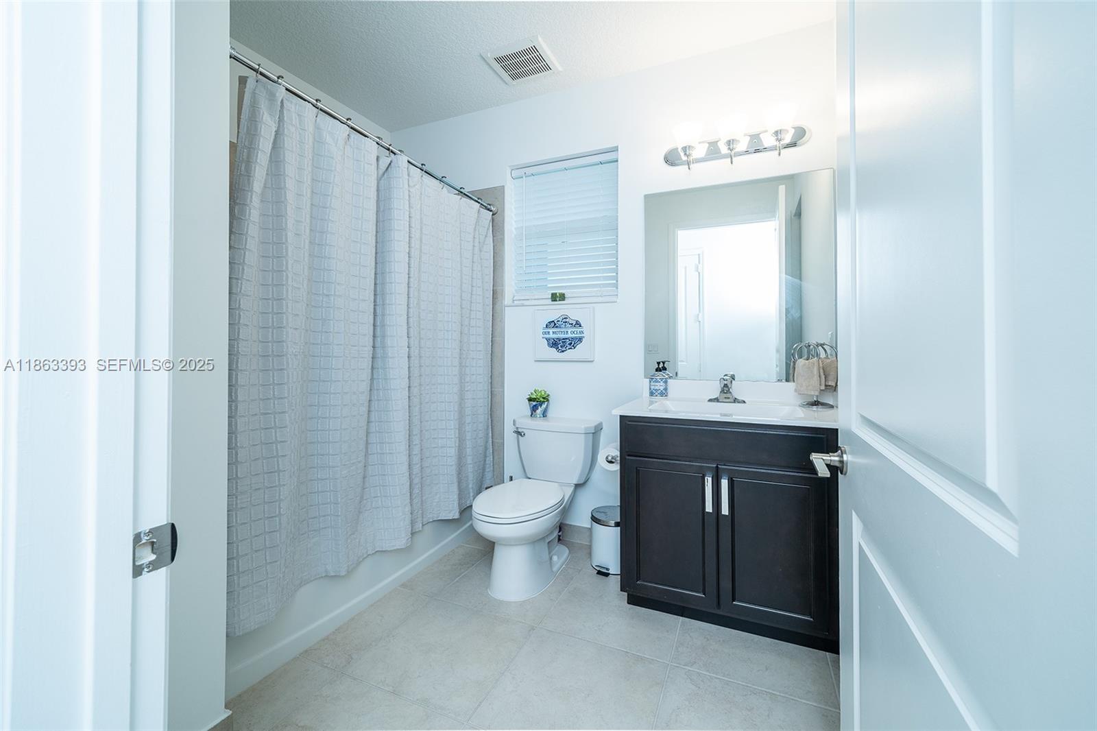 4230 Rosa Drive Deerfield Beach, FL 33064 - Photo 34 of 52 a bathroom with a sink a toilet and shower