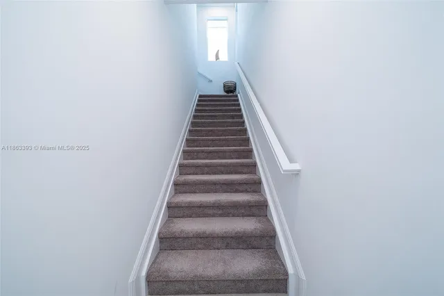 a bedroom with a bed and a television