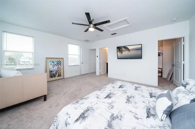 a bedroom with bed and window