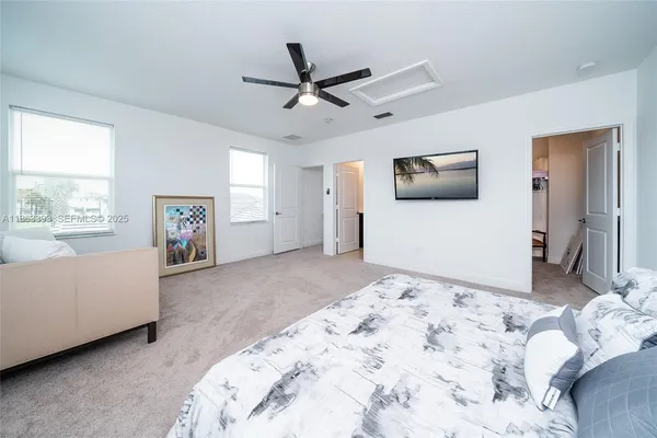 a bedroom with bed and window