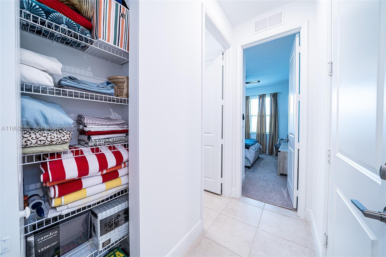 4230 Rosa Drive Deerfield Beach, FL 33064 - Photo 45 of 52 a view of walk in closet with clothes and shoes