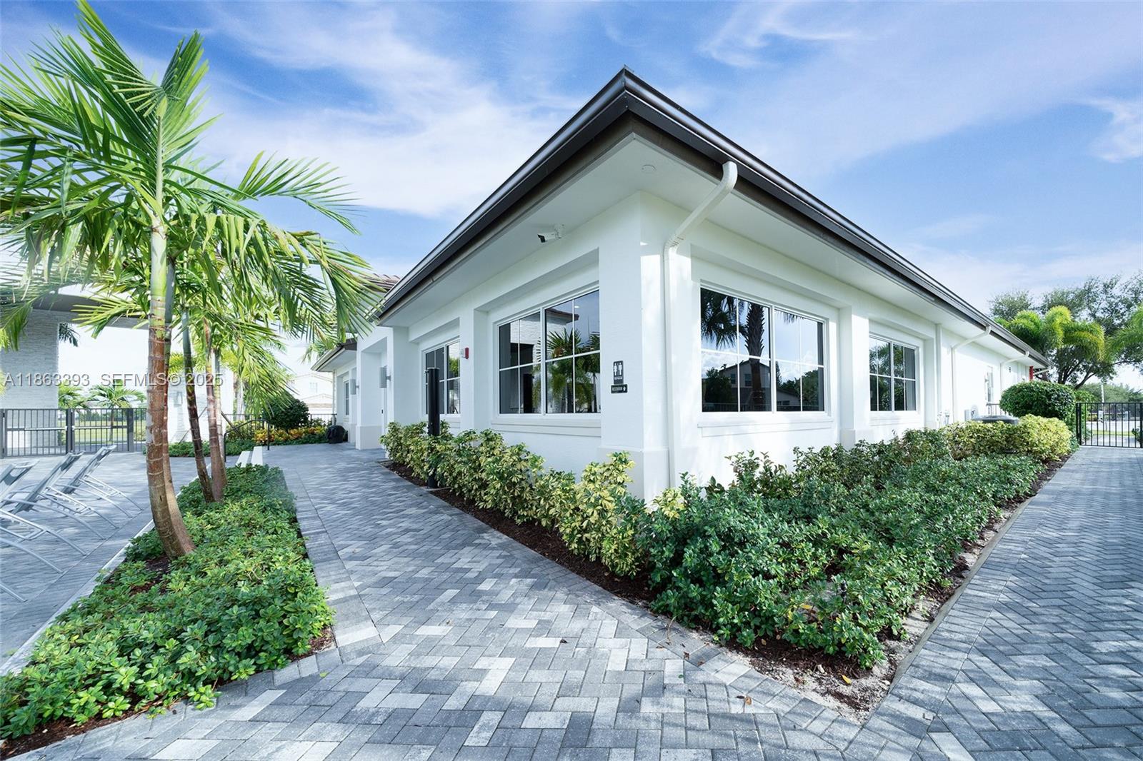 4230 Rosa Drive Deerfield Beach, FL 33064 - Photo 47 of 52 a front view of a house with a yard