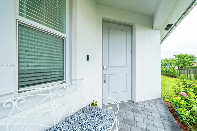 a view of a door and a window