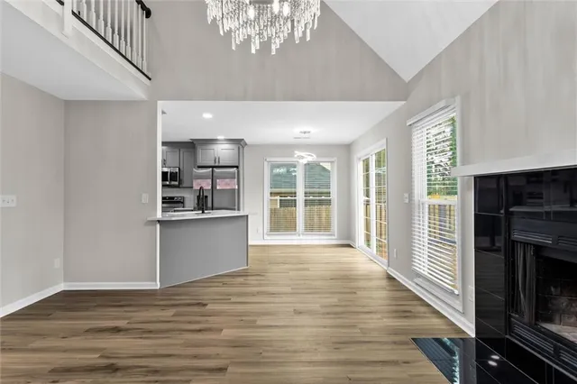 a view of a kitchen with a sink and cabinets