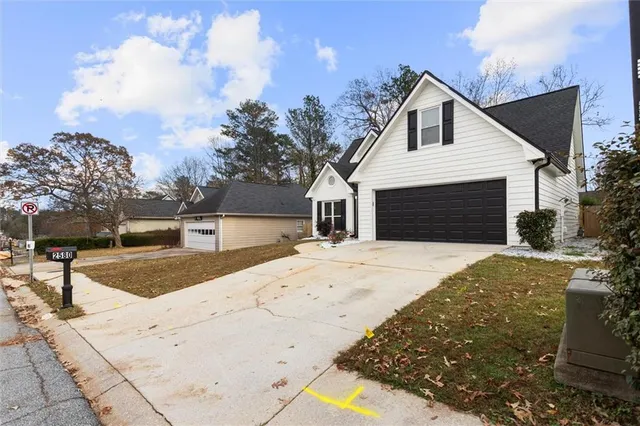 a front view of a house with a yard