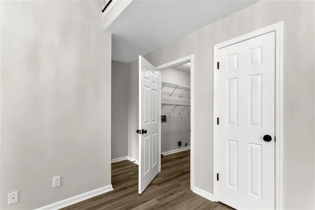 a view of a bathroom with wooden floor