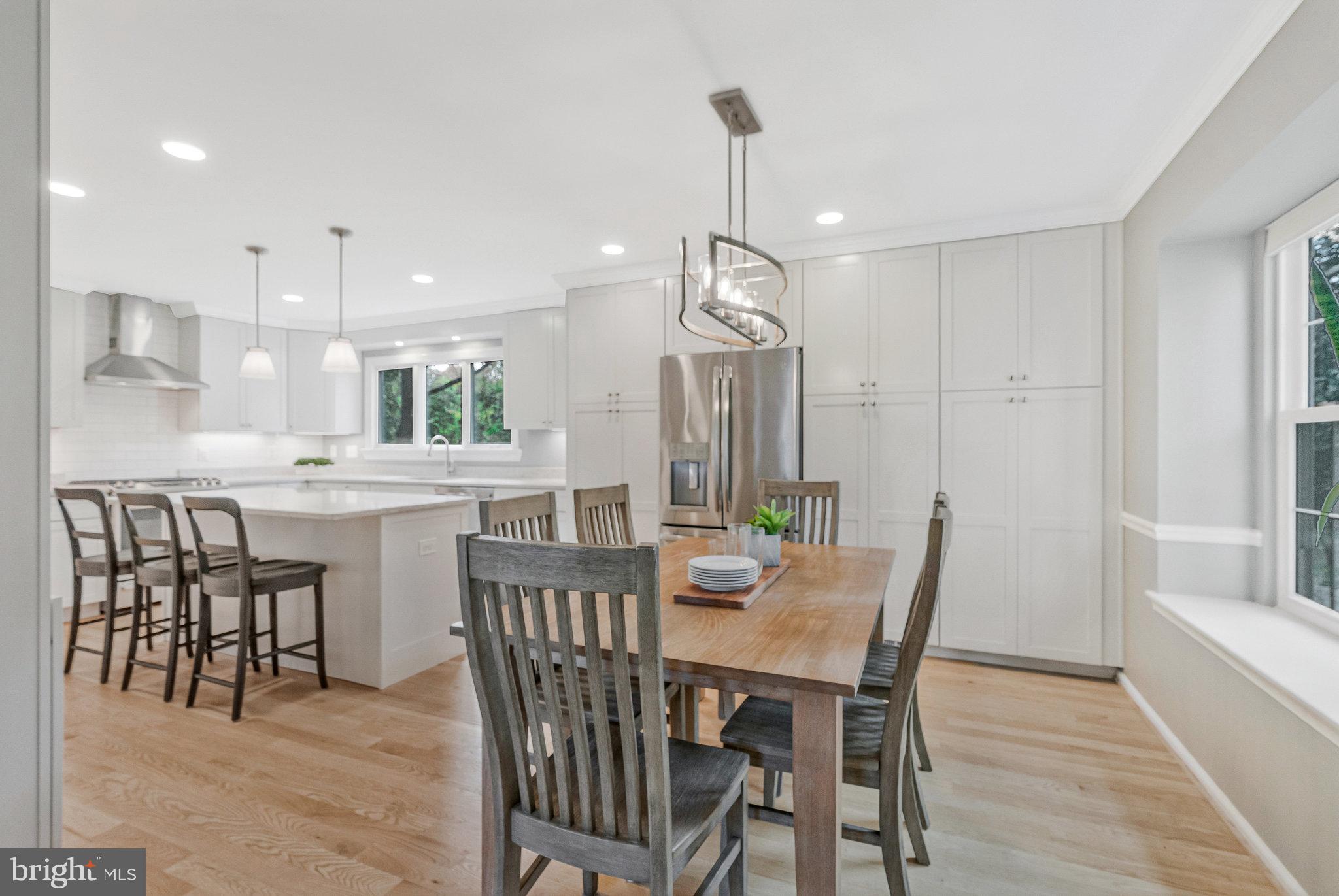 7 South Lowery Court Sterling, VA 20165 - Photo 12 of 63 a view of a dining room and livingroom with furniture wooden floor a chandelier