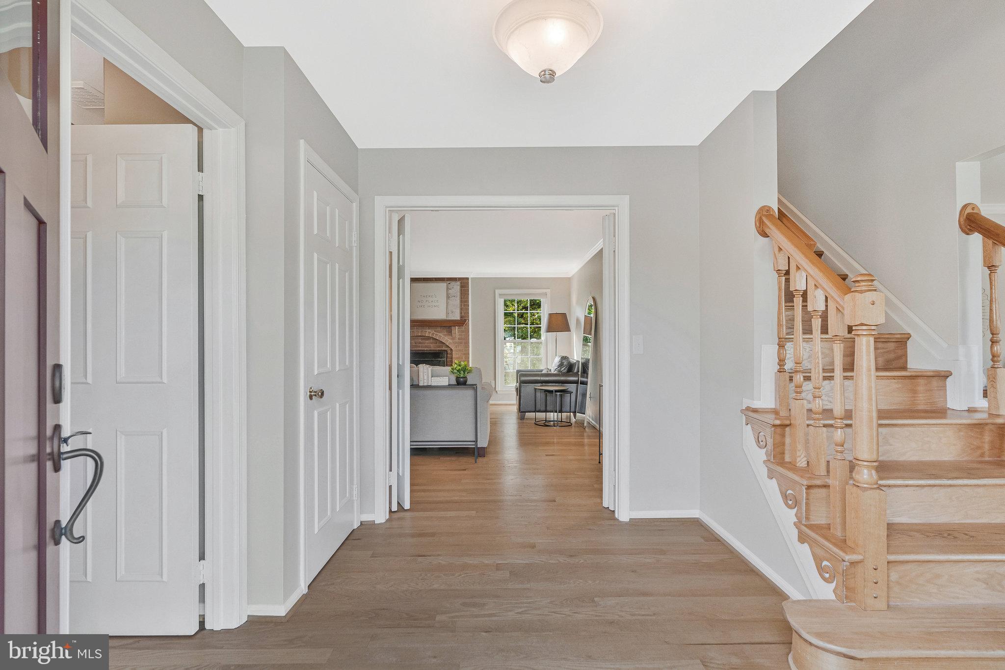 7 South Lowery Court Sterling, VA 20165 - Photo 17 of 63 a view of entryway and hall with wooden floor