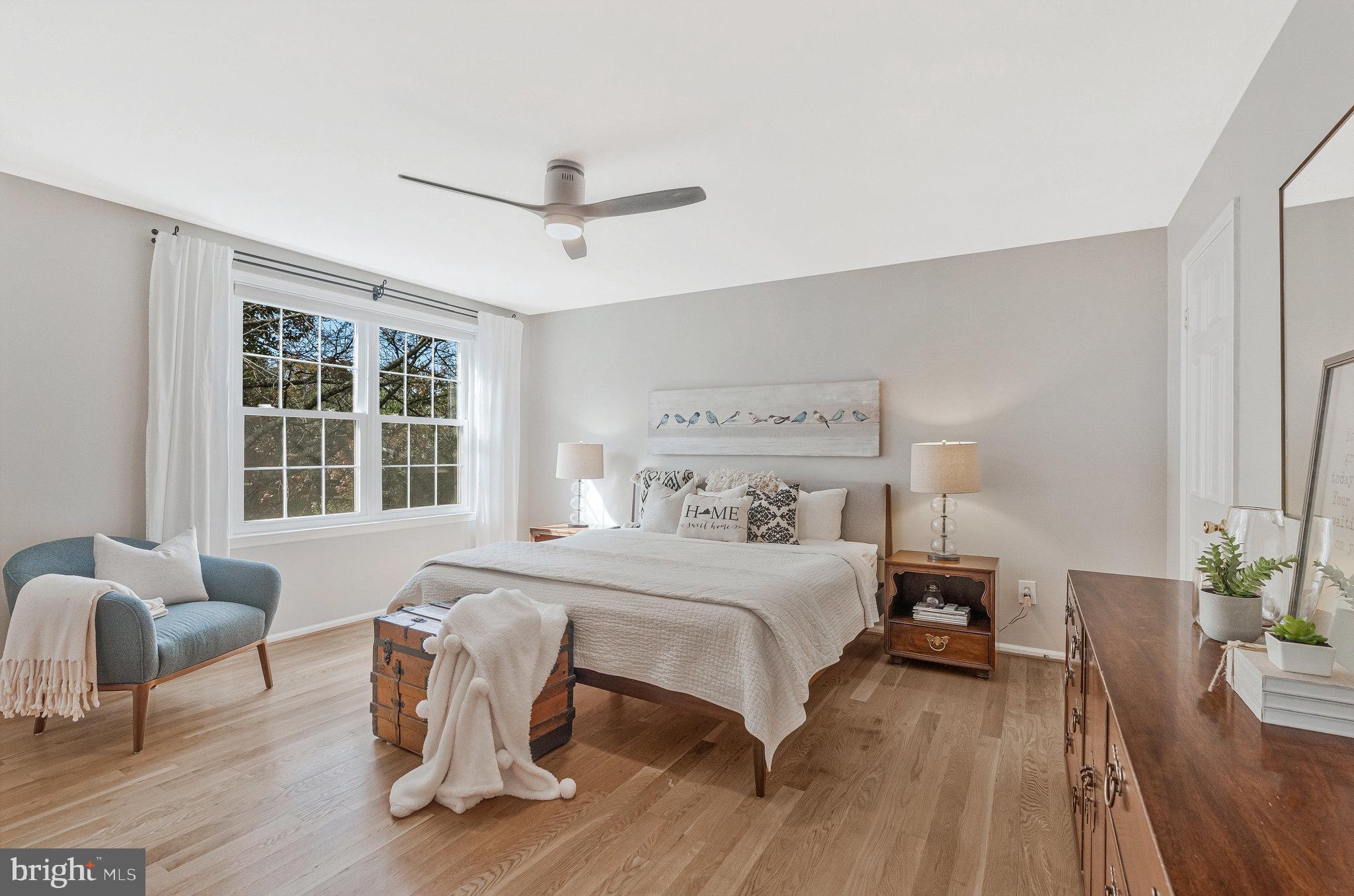 7 South Lowery Court Sterling, VA 20165 - Photo 24 of 63 a bedroom with a bed and wooden floor