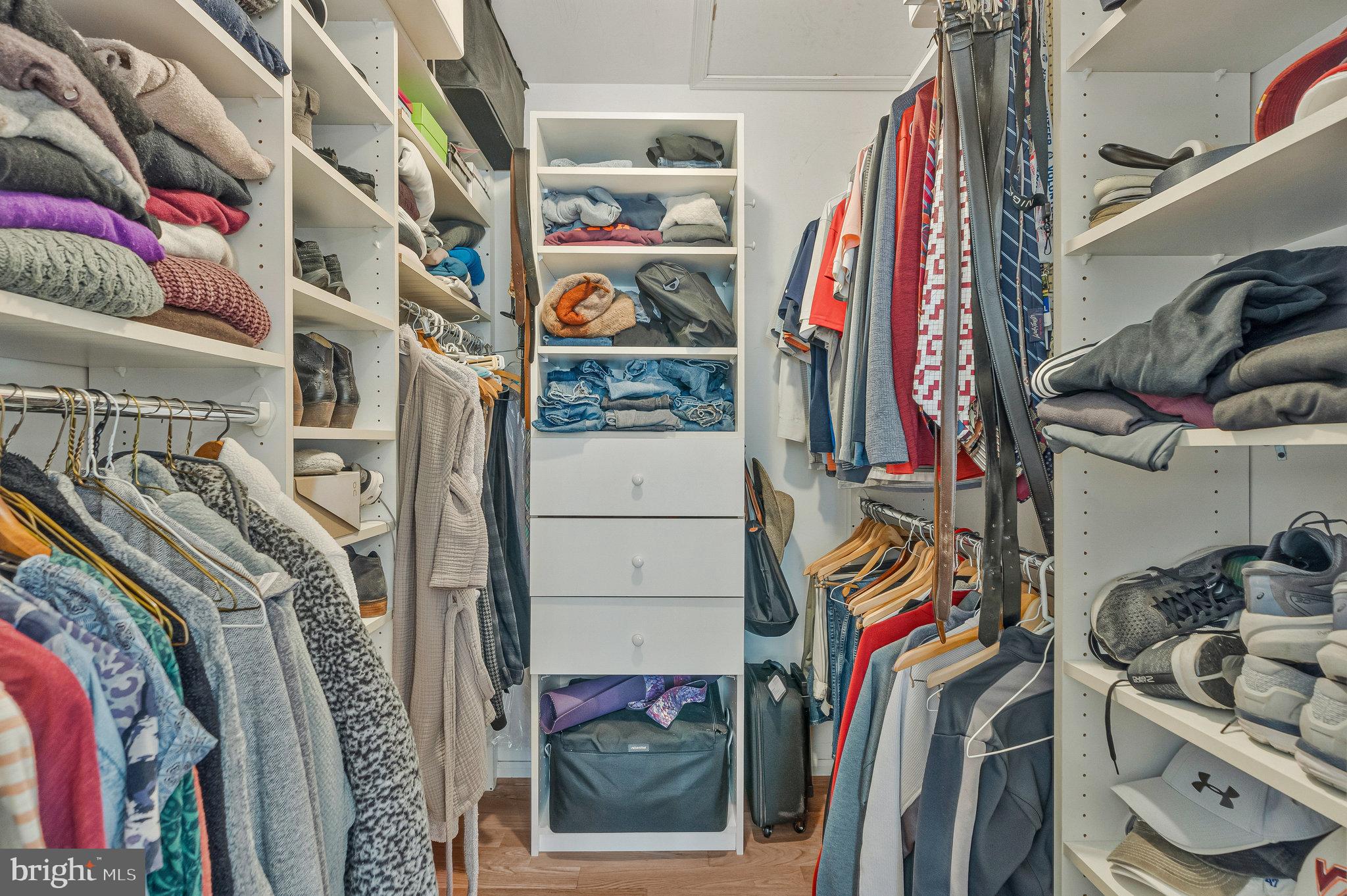 7 South Lowery Court Sterling, VA 20165 - Photo 27 of 63 a view of walk in closet with clothes