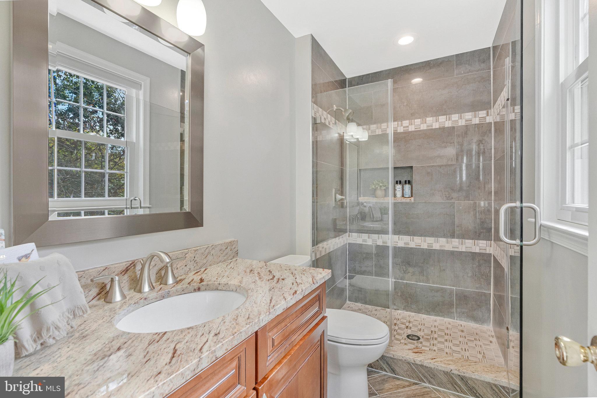 7 South Lowery Court Sterling, VA 20165 - Photo 28 of 63 a bathroom with a granite countertop sink toilet and shower