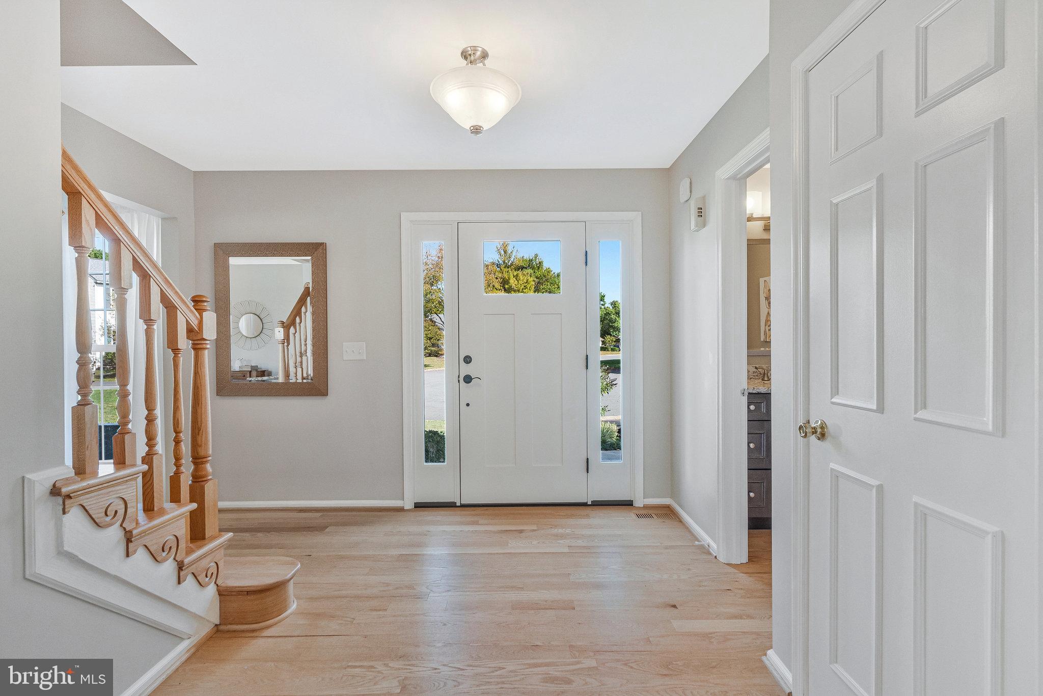 7 South Lowery Court Sterling, VA 20165 - Photo 5 of 63 a view of livingroom with hardwood floor and hallway