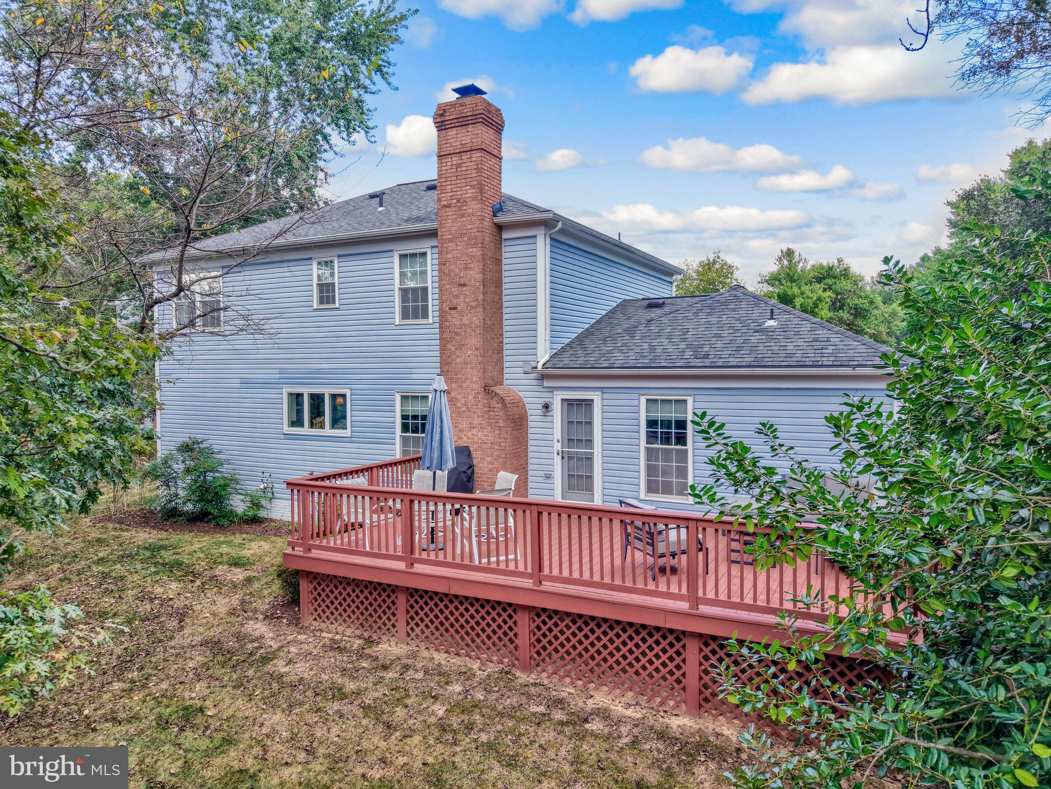 7 South Lowery Court Sterling, VA 20165 - Photo 51 of 63 a view of a house with a yard and wooden fence