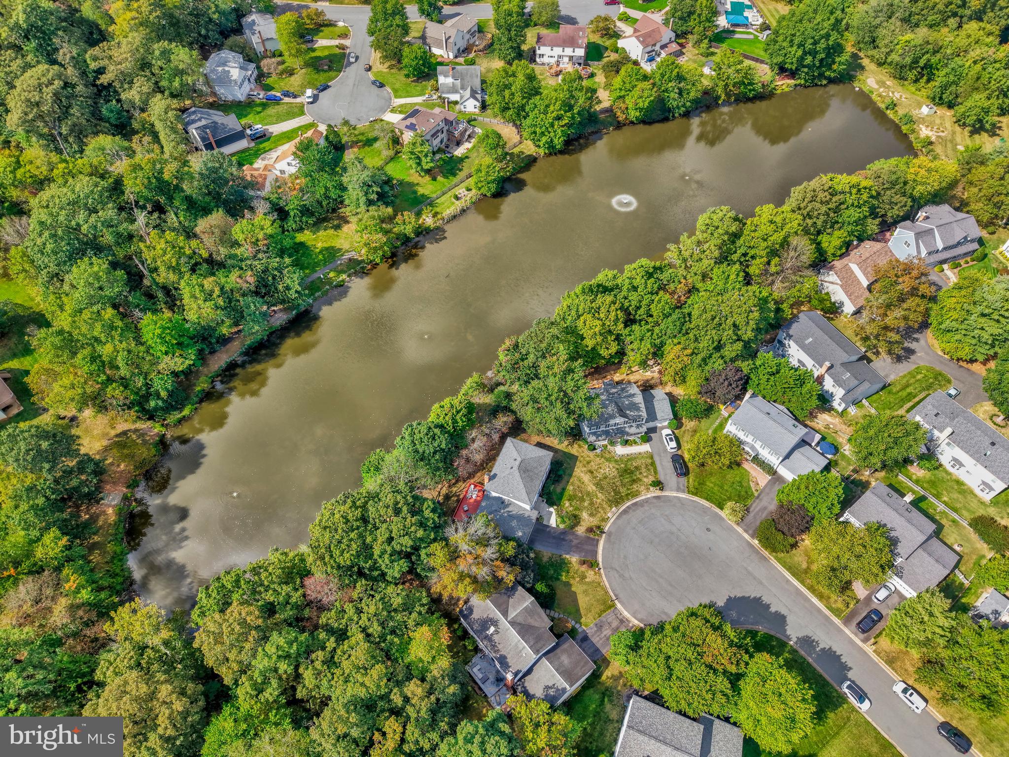 7 South Lowery Court Sterling, VA 20165 - Photo 55 of 63 an aerial view of a house with a yard and lake view
