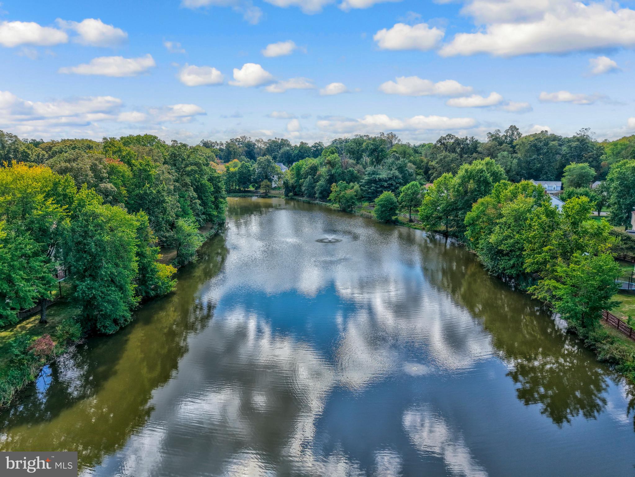 7 South Lowery Court Sterling, VA 20165 - Photo 58 of 63 a view of a lake from a yard