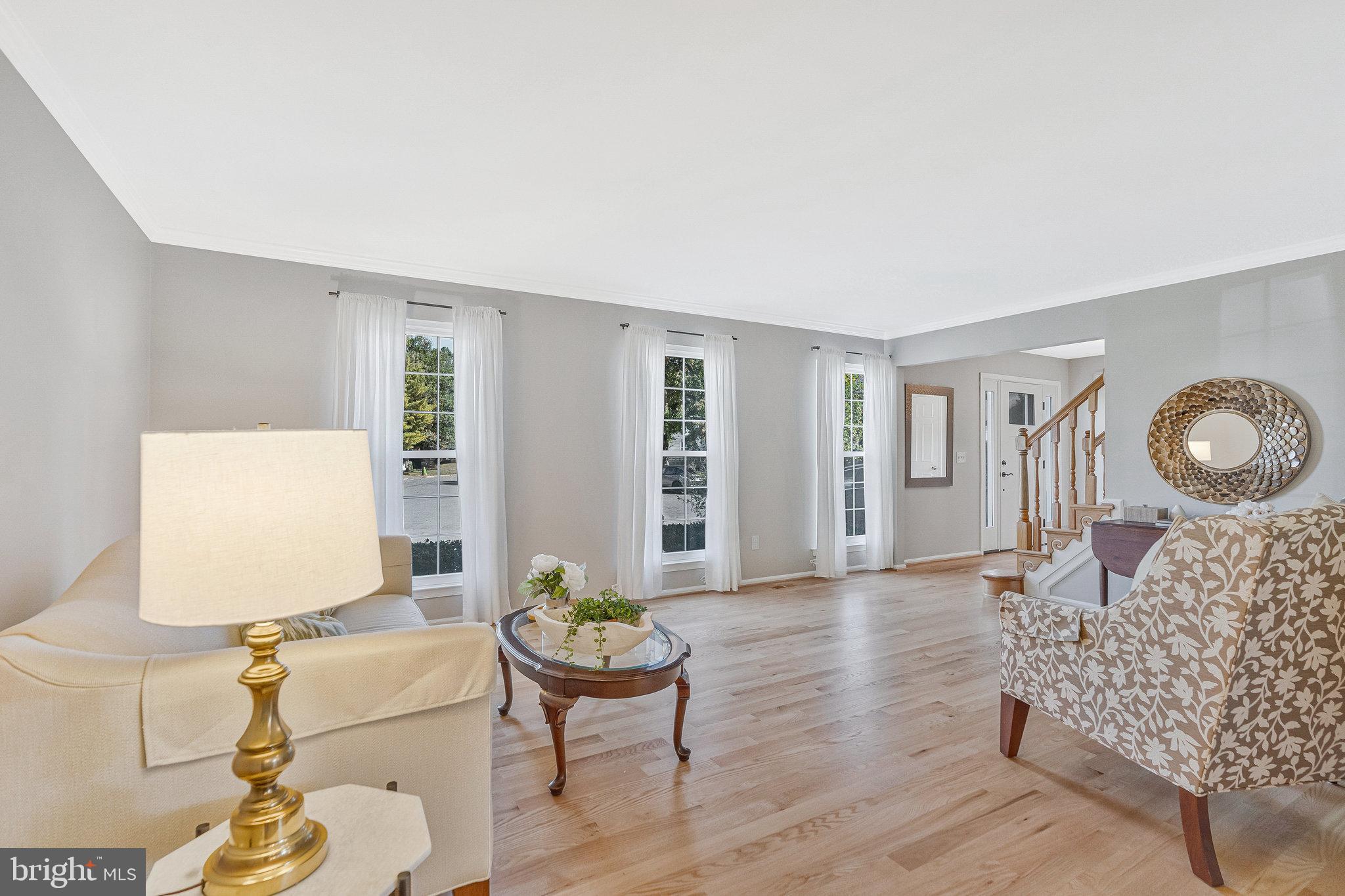 7 South Lowery Court Sterling, VA 20165 - Photo 8 of 63 a living room with furniture and wooden floor