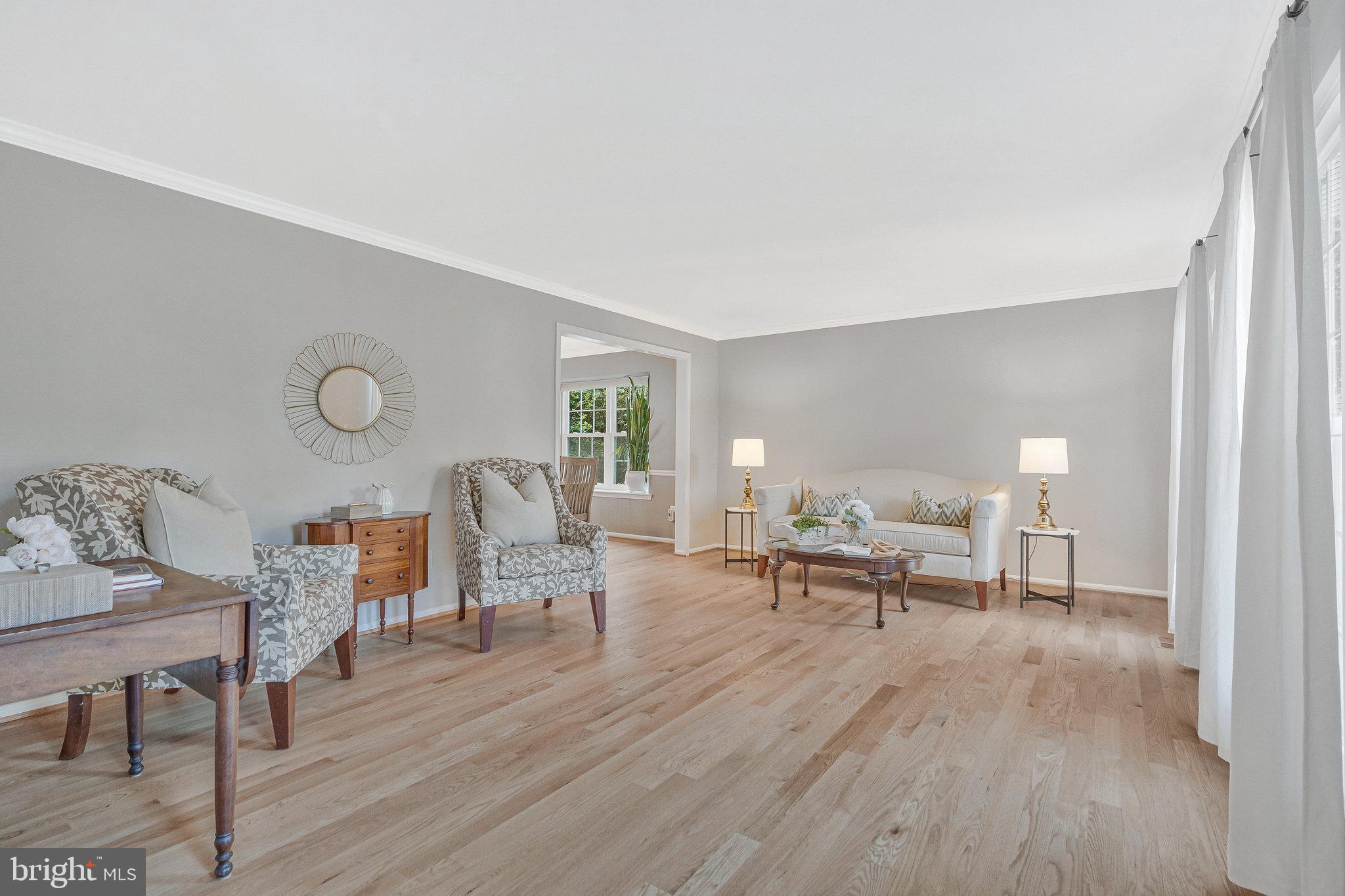 7 South Lowery Court Sterling, VA 20165 - Photo 9 of 63 a living room with furniture and a table