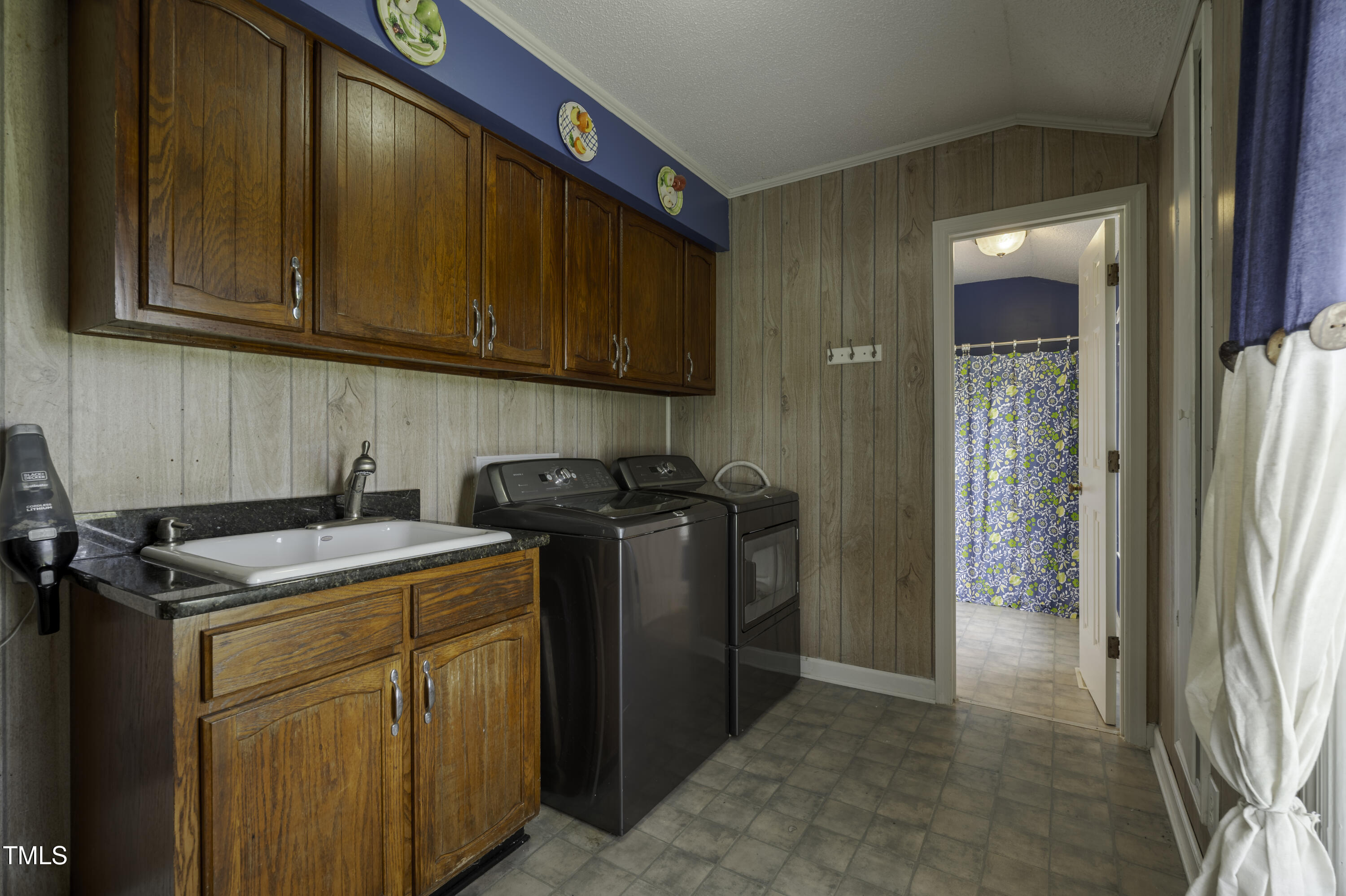 623 O B J Road Dunn, NC 28334 - Photo 11 of 36 a kitchen with stainless steel appliances granite countertop a refrigerator and a sink