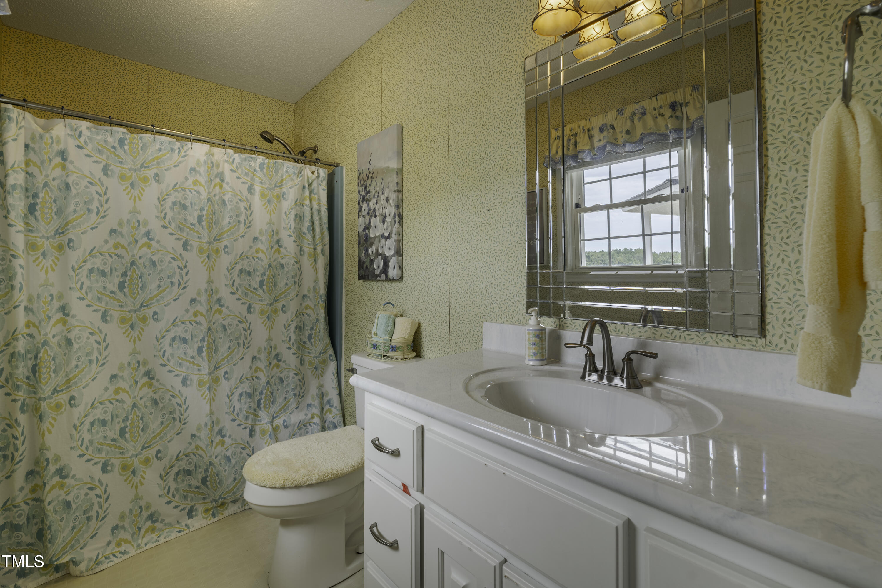 623 O B J Road Dunn, NC 28334 - Photo 14 of 36 a bathroom with a sink and a toilet