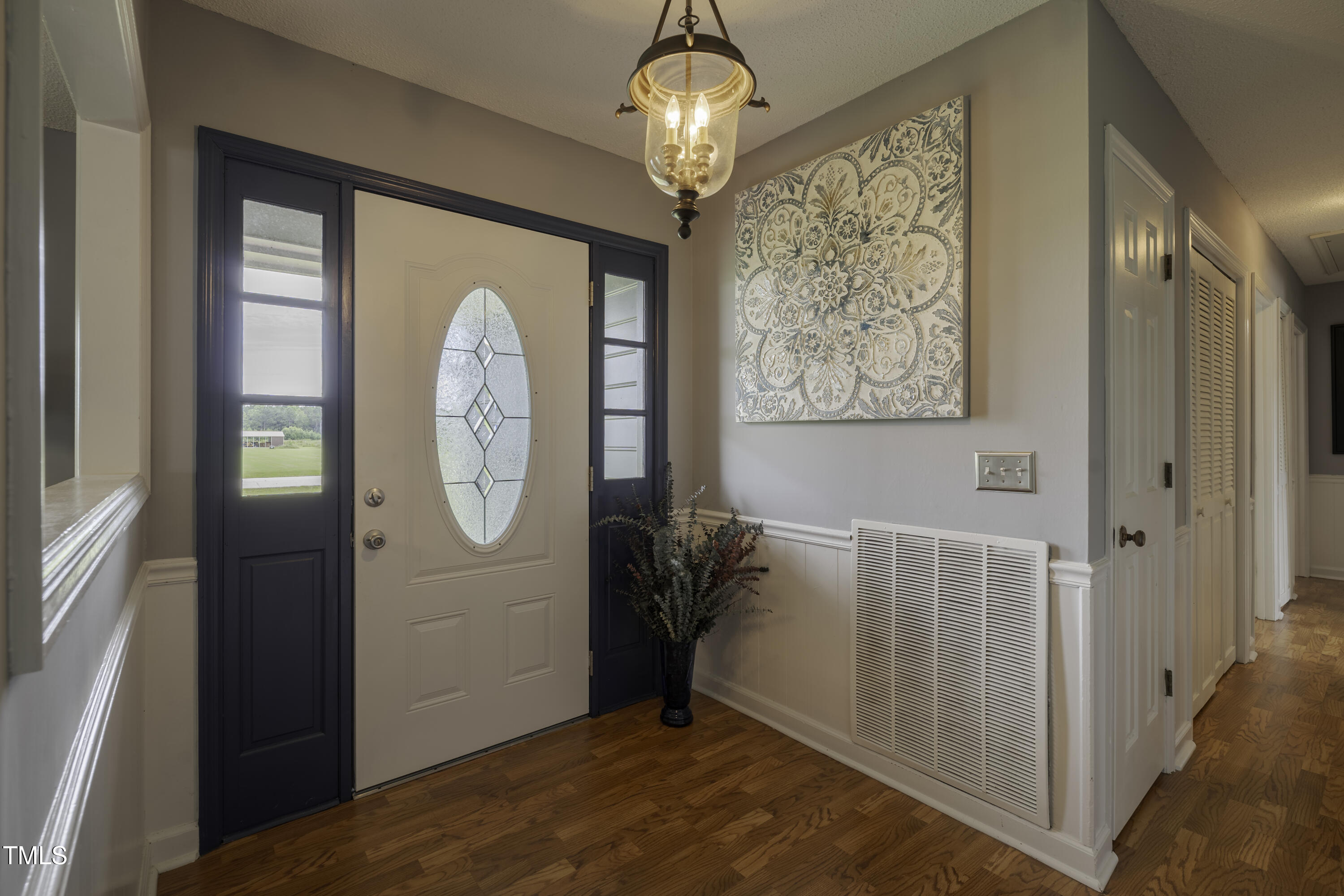 623 O B J Road Dunn, NC 28334 - Photo 17 of 36 a view of a hallway with entryway wooden floor and front door