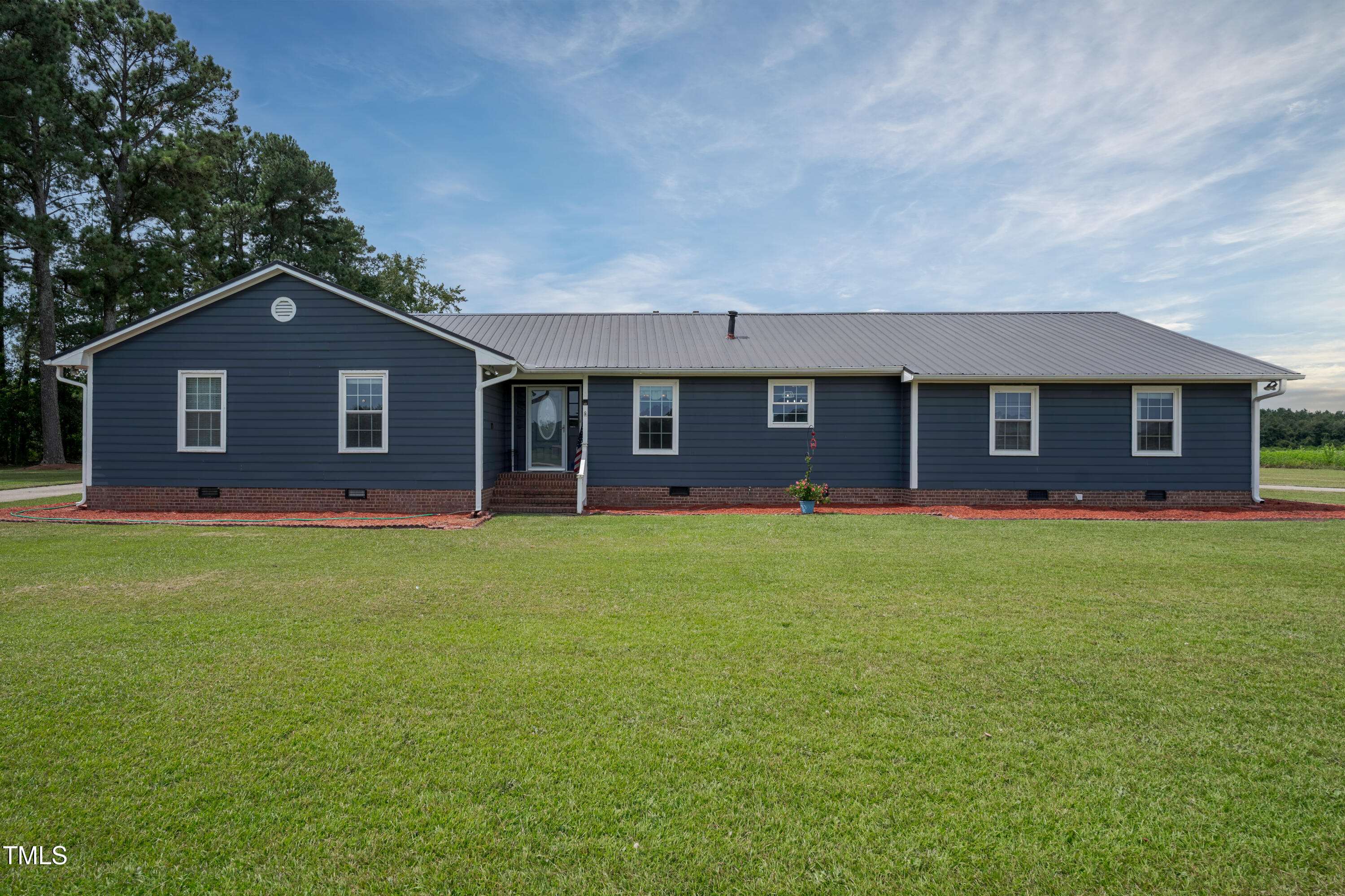 623 O B J Road Dunn, NC 28334 - Photo 24 of 36 a front view of a house with a garden