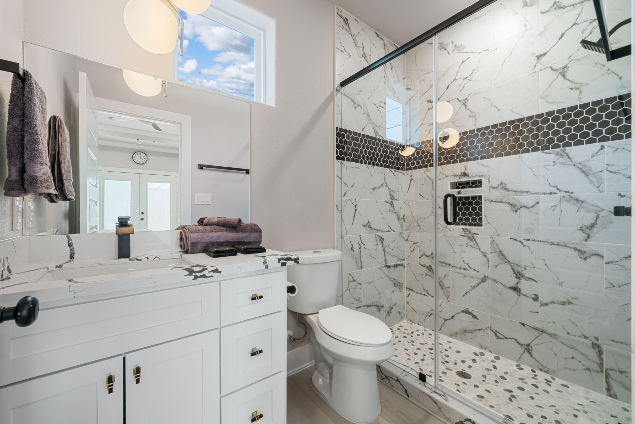 8521 Brandon Bldg-d Street, Unit STUDIO Houston, TX 77072 - Photo 3 of 9 a bathroom with a sink toilet a mirror and shower