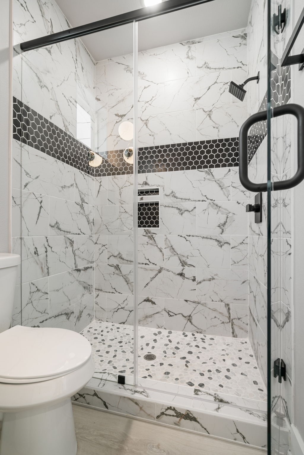 8521 Brandon Bldg-d Street, Unit STUDIO Houston, TX 77072 - Photo 4 of 9 a bathroom with a toilet and a shower