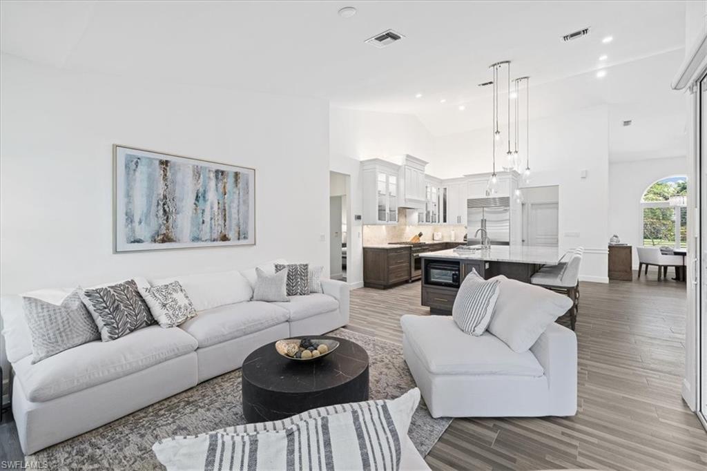 2032 Prince Drive Naples, FL 34110 - Photo 13 of 44 a living room with furniture and a wooden floor
