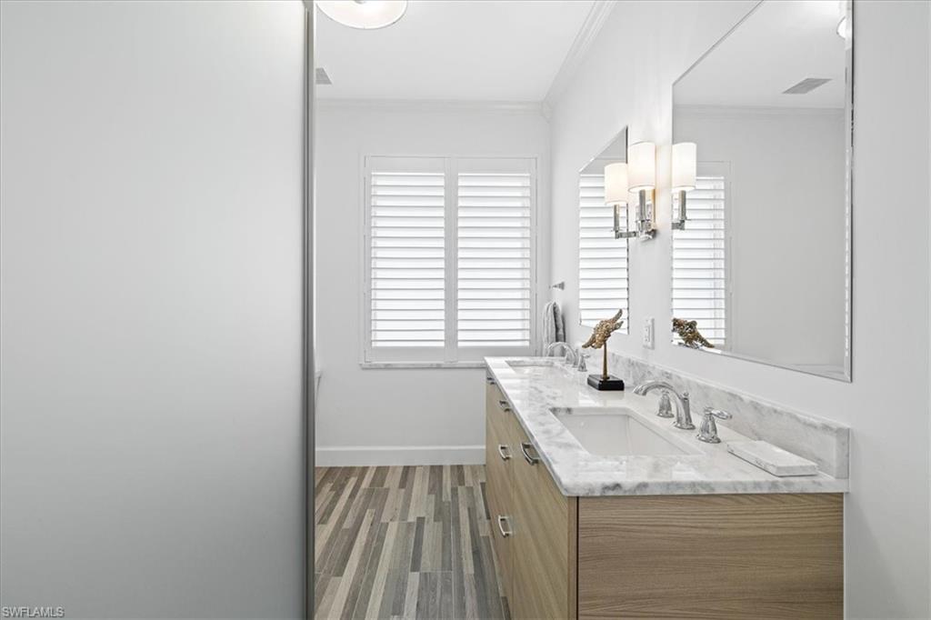 2032 Prince Drive Naples, FL 34110 - Photo 23 of 44 a bathroom with a sink and a mirror