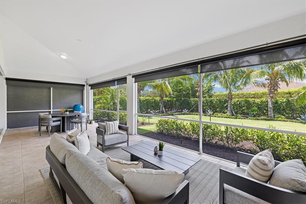 2032 Prince Drive Naples, FL 34110 - Photo 25 of 44 a living room with furniture and a large window