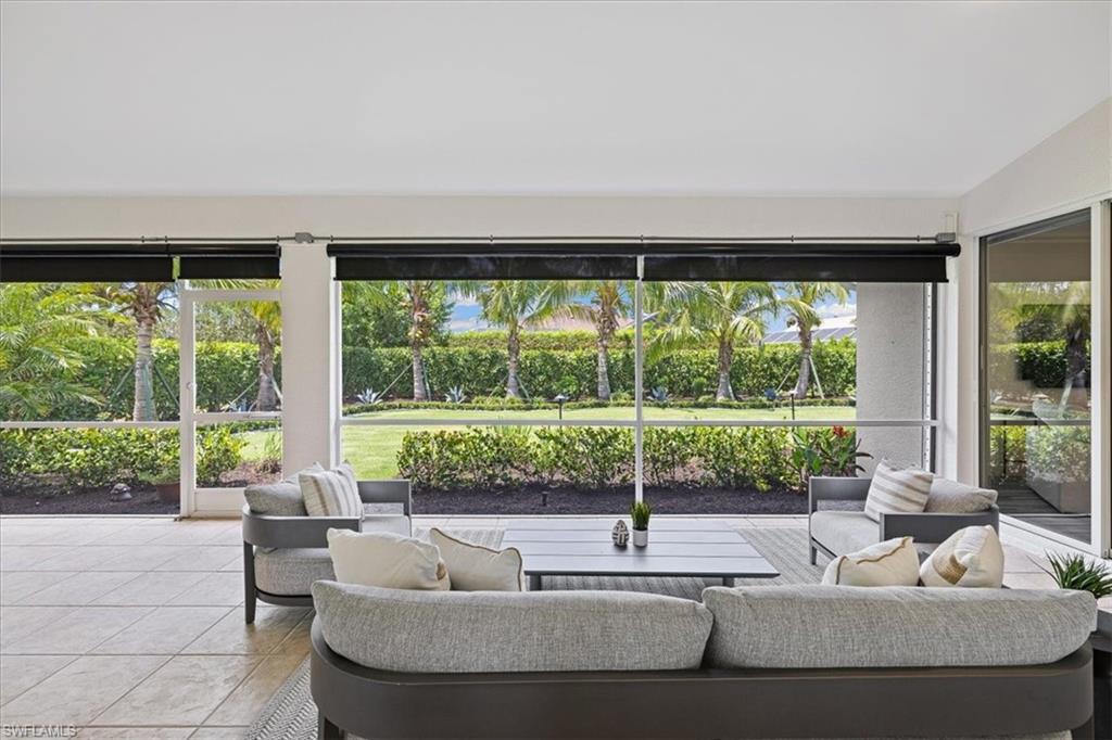 2032 Prince Drive Naples, FL 34110 - Photo 26 of 44 a living room with couch and a large window