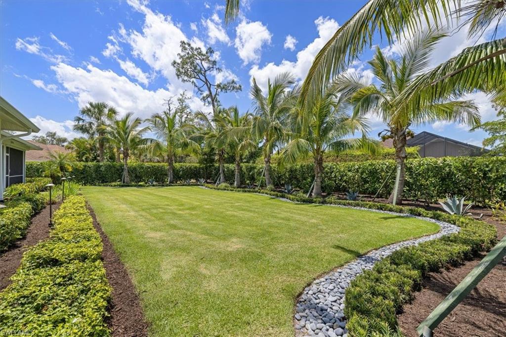 2032 Prince Drive Naples, FL 34110 - Photo 29 of 44 a view of a yard with palm trees