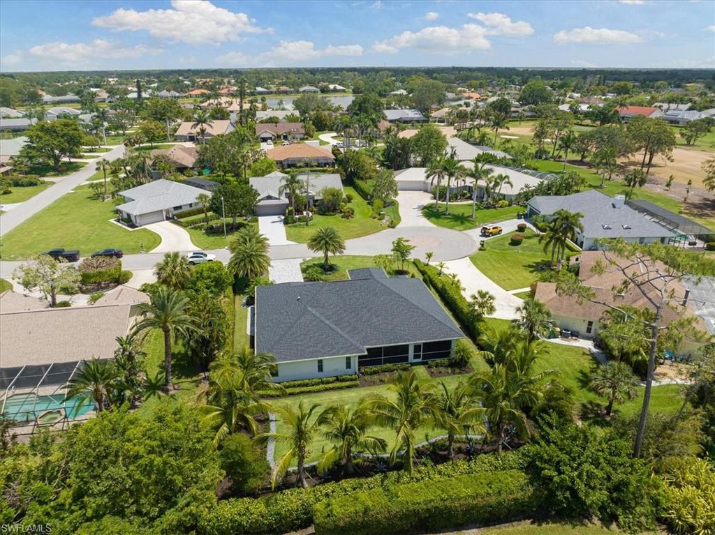 2032 Prince Drive Naples, FL 34110 - Photo 31 of 44 an aerial view of residential houses with outdoor space and trees