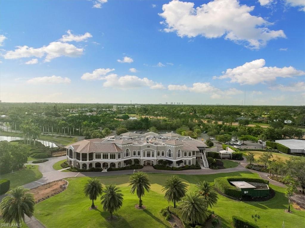 2032 Prince Drive Naples, FL 34110 - Photo 36 of 44 a view of a lake with houses