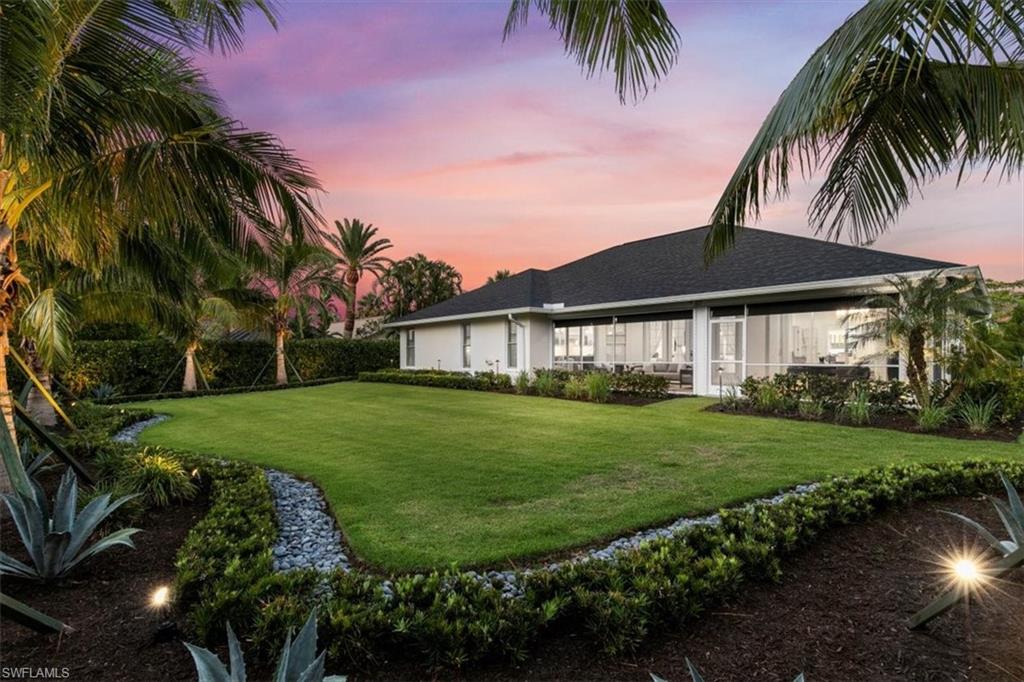 2032 Prince Drive Naples, FL 34110 - Photo 38 of 44 a front view of a house with a garden