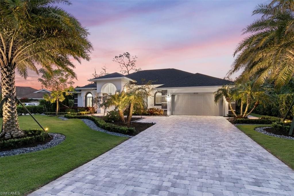 2032 Prince Drive Naples, FL 34110 - Photo 42 of 44 a front view of a house with garden