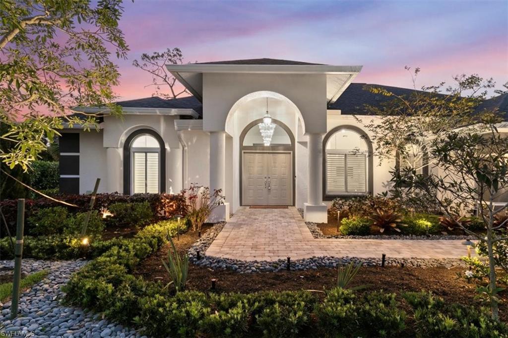 2032 Prince Drive Naples, FL 34110 - Photo 44 of 44 a front view of a house with a yard