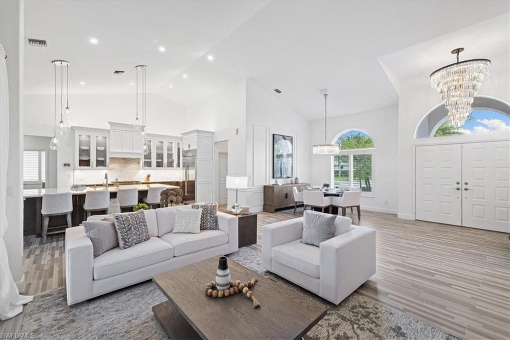 2032 Prince Drive Naples, FL 34110 - Photo 6 of 44 a living room with furniture kitchen view and a wooden floor