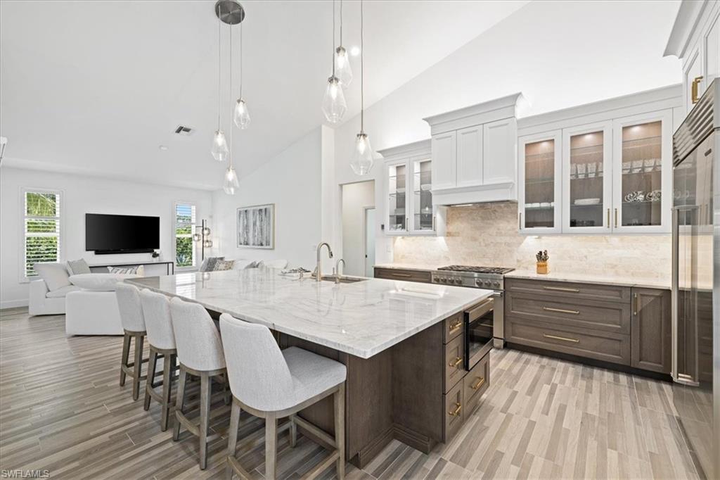2032 Prince Drive Naples, FL 34110 - Photo 9 of 44 a kitchen with a stove a sink and a refrigerator