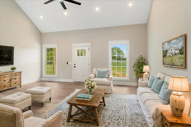 a living room with furniture and a flat screen tv